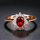 Bague vintage en or rose avec pierre ovale rouge au centre