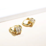 Boucles d'oreilles vintage en or avec breloques roulantes