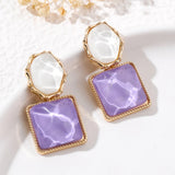 Boucles d'oreilles vintage violettes et perles