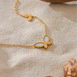 Collier vintage avec pendentif papillon en or