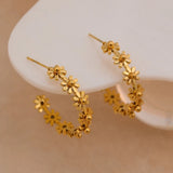 Boucles d'oreilles créoles avec pendentifs floraux en or