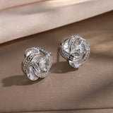 Boucles d'oreilles clous argentées entrelacées scintillantes