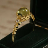 Bague ajustable rétro en or et pierre précieuse vert olive