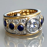 Bague vintage épaisse en or et argent avec zircone bleue et blanche
